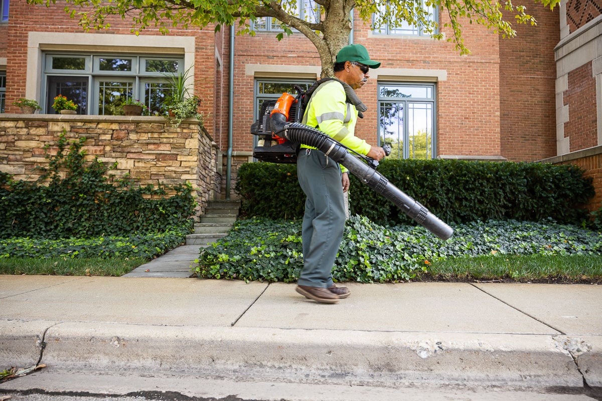 commercial landscape maintenance retirement crew clearing off sidewalks 2