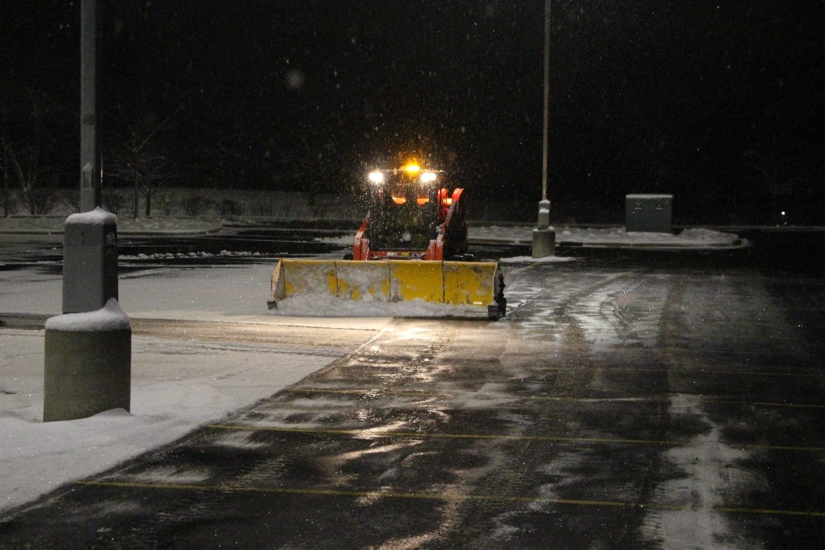 commercial snowplow at night